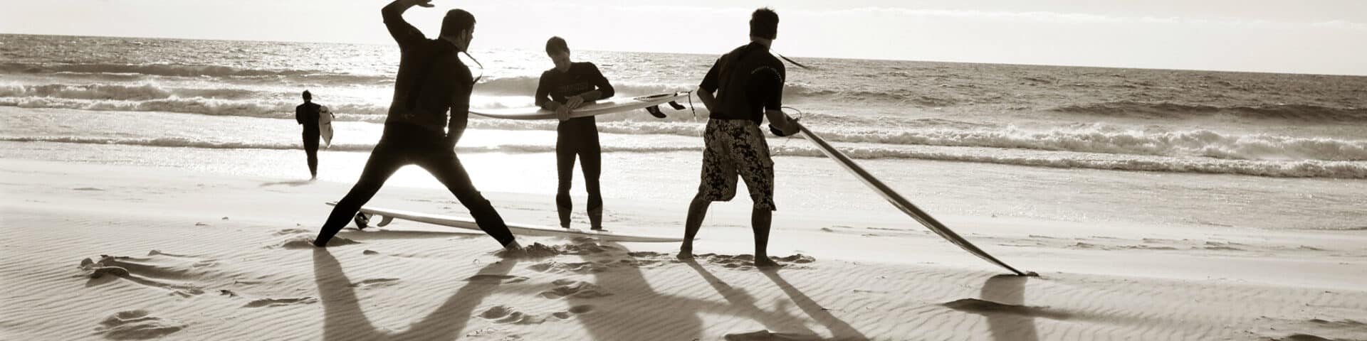 guys on beach w boards